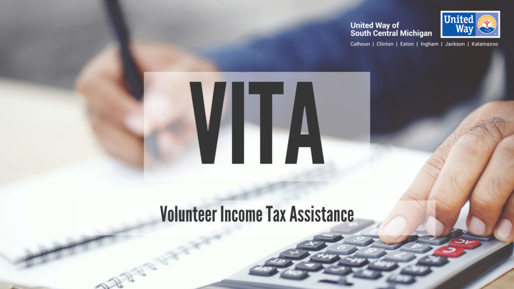 A photo shows a hand with a pen writing down figures next to a calculator. Words over top of the image read: VITA: Volunteer Income Tax Assistance