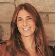 Headshot of Alyssa Stewart, a white woman with brown hair.