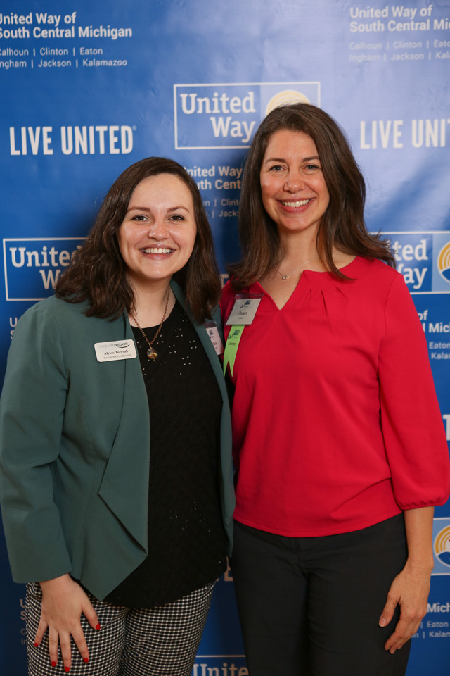 Two women in front of United Way backdrop