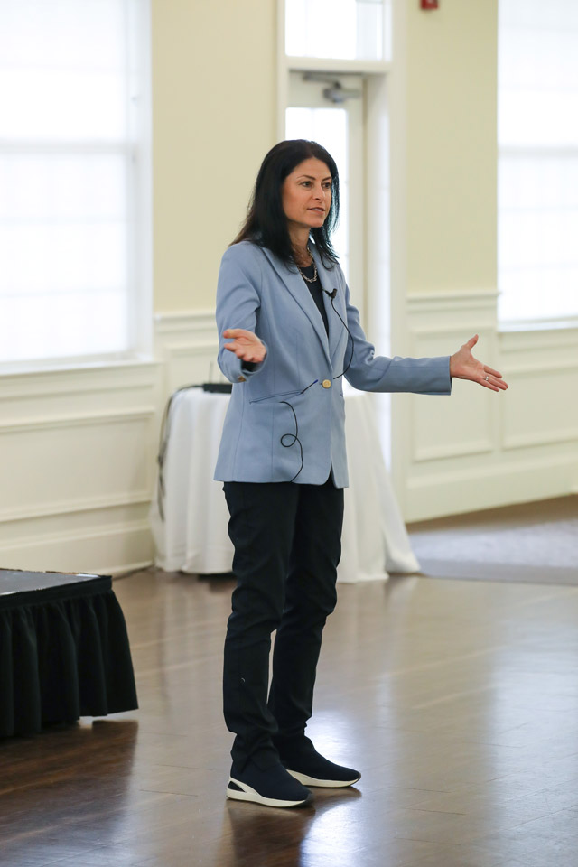 Dana Nessel stands at front of room.